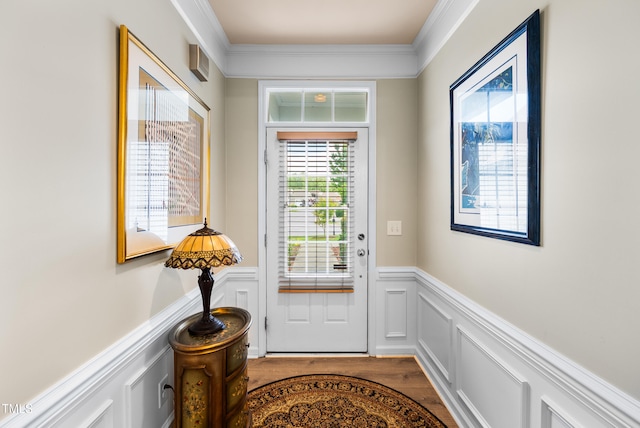 575 Tomkins Loop, Cary, NC 27519 - entryway with ornamental molding, a wainscoted wall, wood finished floors, and a decorative wall