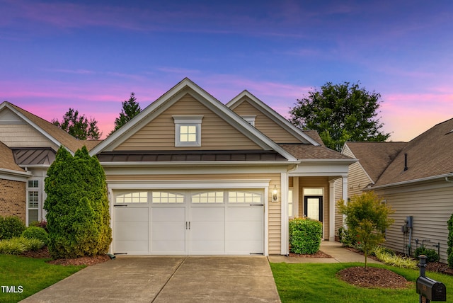575 Tomkins Loop, Cary, NC 27519 - view of front of property featuring concrete driveway, a standing seam roof, a garage, a shingled roof, and a metal roof