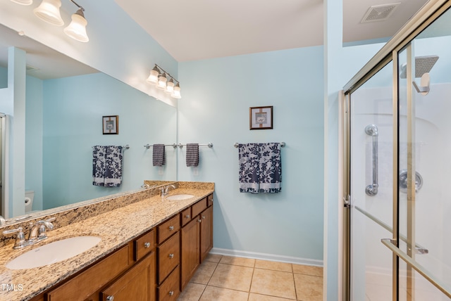 575 Tomkins Loop, Cary, NC 27519 - full bath featuring double vanity, a stall shower, and tile patterned flooring
