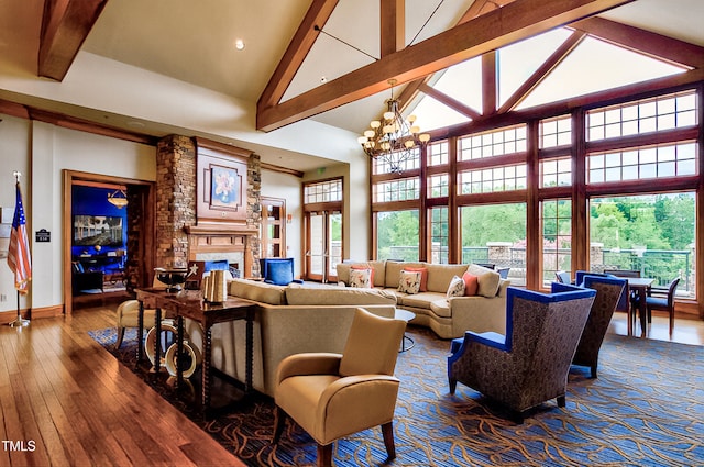 575 Tomkins Loop, Cary, NC 27519 - living area with high vaulted ceiling, a fireplace, beamed ceiling, dark wood-type flooring, and a chandelier