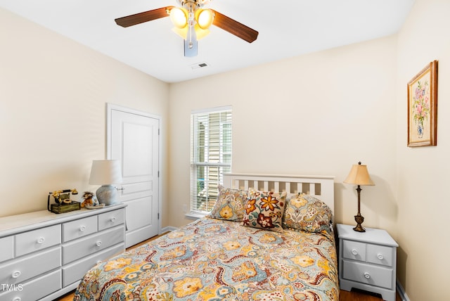 575 Tomkins Loop, Cary, NC 27519 - bedroom with wood finished floors and a ceiling fan
