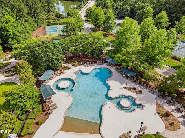 575 Tomkins Loop, Cary, NC 27519 - view of swimming pool with a water view, a patio area, and a pool with connected hot tub