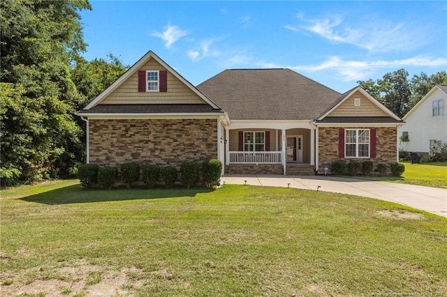 4817 Kiara Dr, Hope Mills, NC 28348 - craftsman-style home featuring a porch, stone siding, a front lawn, and a shingled roof