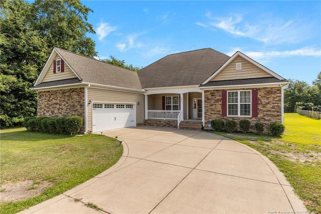 4817 Kiara Dr, Hope Mills, NC 28348 - view of front of house with a porch, a garage, driveway, a front yard, and stone siding