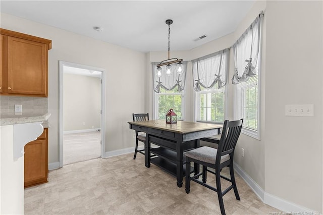 4817 Kiara Dr, Hope Mills, NC 28348 - dining area with baseboards and a chandelier