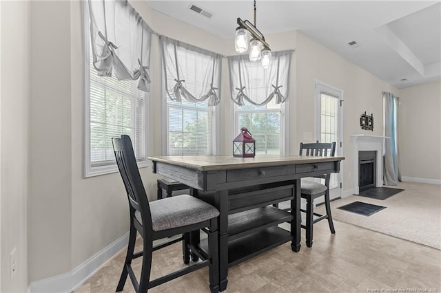 4817 Kiara Dr, Hope Mills, NC 28348 - dining space with baseboards and a fireplace with flush hearth
