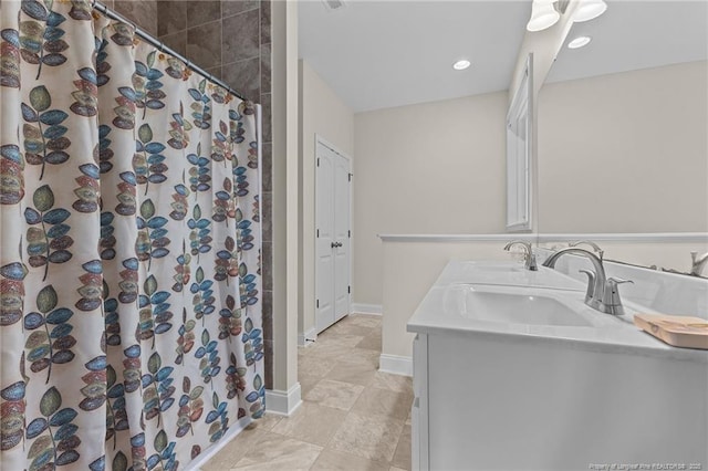 4817 Kiara Dr, Hope Mills, NC 28348 - full bathroom with double vanity, a shower with shower curtain, and recessed lighting
