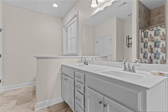4817 Kiara Dr, Hope Mills, NC 28348 - bathroom featuring double vanity and a tile shower