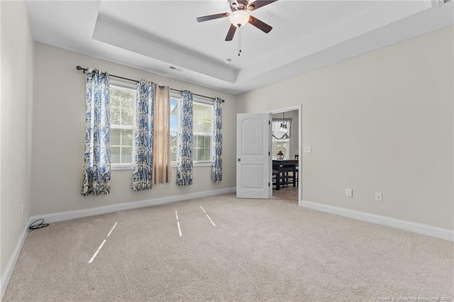 4817 Kiara Dr, Hope Mills, NC 28348 - carpeted empty room featuring ceiling fan and a raised ceiling