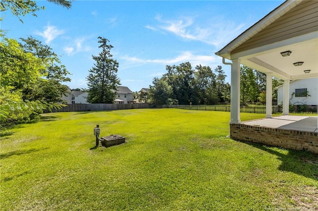 4817 Kiara Dr, Hope Mills, NC 28348 - fenced backyard featuring a patio area and an outdoor fire pit