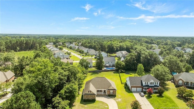 4817 Kiara Dr, Hope Mills, NC 28348 - aerial perspective of suburban area featuring a forest