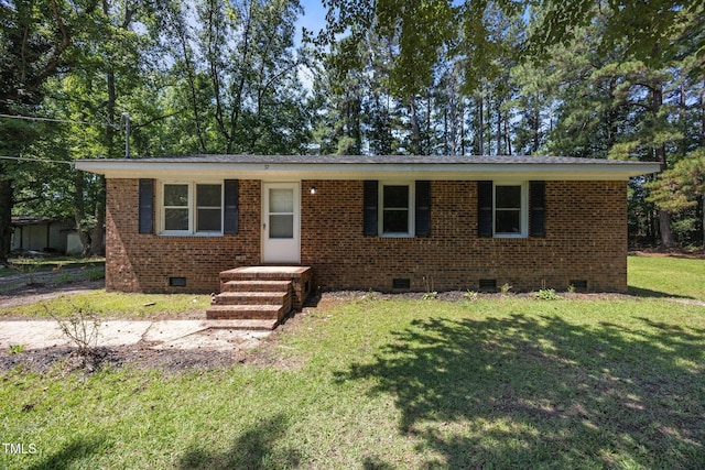37 Weeping Willow Ln, Lillington, NC 27546 - view of front of house with crawl space, a front yard, and brick siding