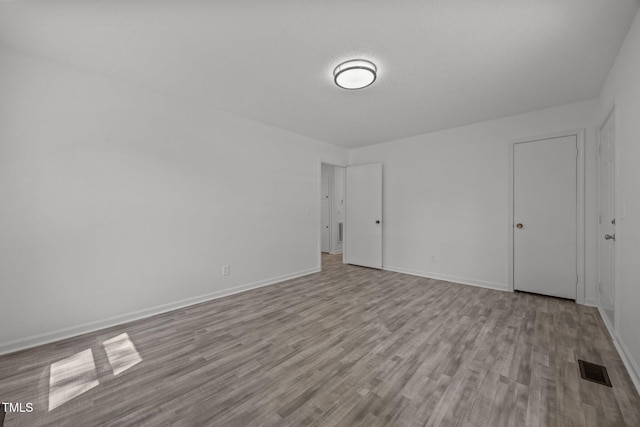 37 Weeping Willow Ln, Lillington, NC 27546 - unfurnished bedroom featuring wood finished floors and baseboards