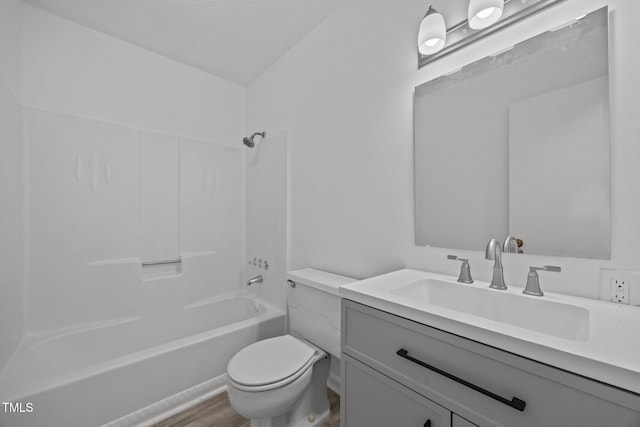 37 Weeping Willow Ln, Lillington, NC 27546 - bathroom featuring vanity, bathtub / shower combination, a textured ceiling, and wood finished floors