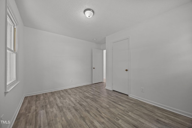 37 Weeping Willow Ln, Lillington, NC 27546 - unfurnished room with wood finished floors and a textured ceiling