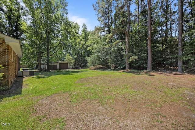 37 Weeping Willow Ln, Lillington, NC 27546 - view of grassy yard with a garage