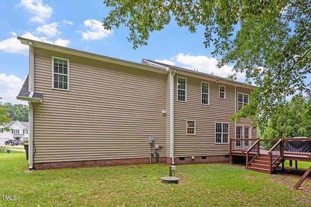 161 Jacob St, Holly Springs, NC 27540 - rear view of house with crawl space, a wooden deck, and a yard