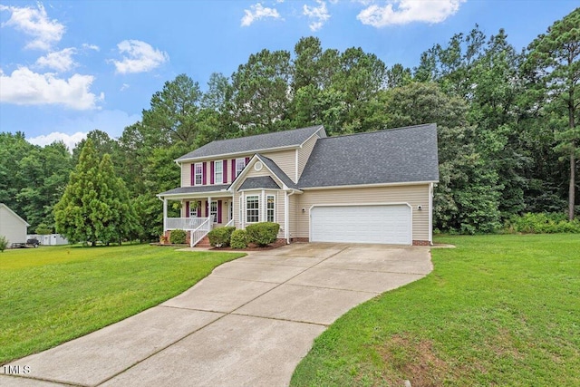 161 Jacob St, Holly Springs, NC 27540 - view of front of property featuring covered porch, driveway, a front yard, and an attached garage
