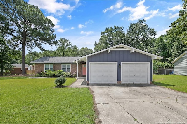 6501 Senator Dr, Fayetteville, NC 28304 - ranch-style home featuring board and batten siding, a garage, driveway, and brick siding