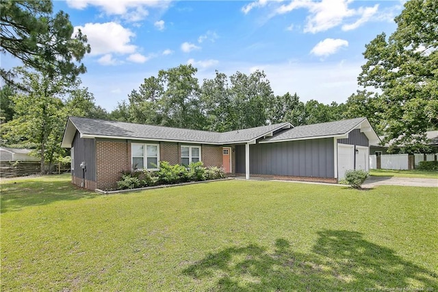 6501 Senator Dr, Fayetteville, NC 28304 - view of front of house featuring a garage, concrete driveway, a shingled roof, and brick siding
