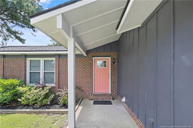 6501 Senator Dr, Fayetteville, NC 28304 - view of exterior entry with brick siding and board and batten siding