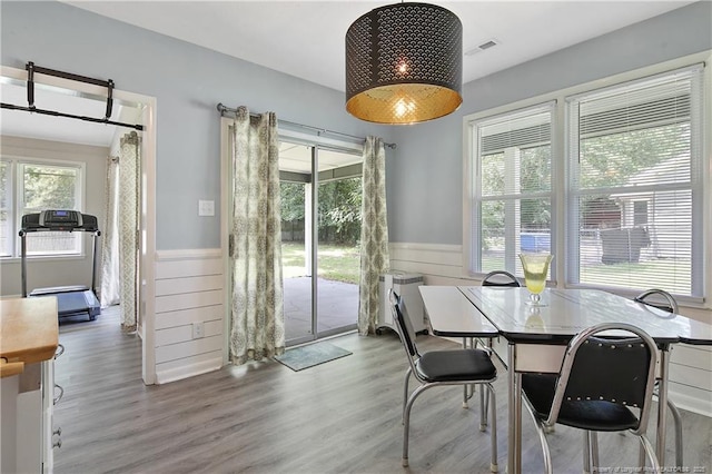 6501 Senator Dr, Fayetteville, NC 28304 - dining room with a wainscoted wall and wood finished floors