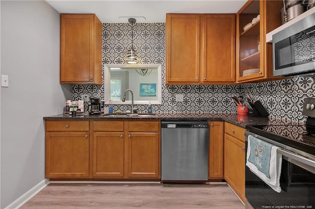 6501 Senator Dr, Fayetteville, NC 28304 - kitchen featuring stainless steel appliances, dark stone counters, and tasteful backsplash