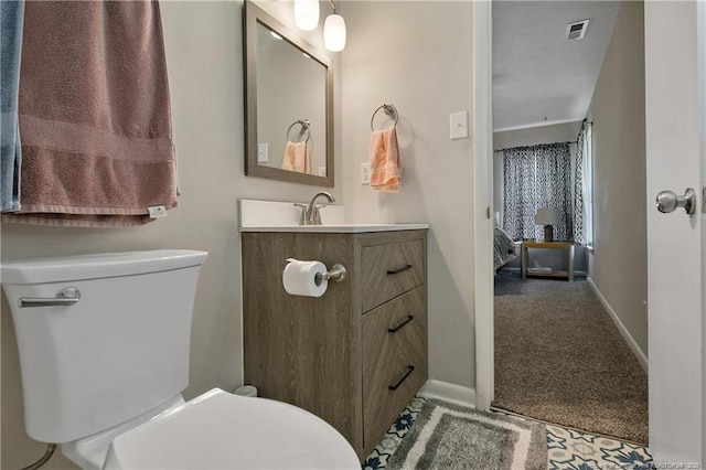 6501 Senator Dr, Fayetteville, NC 28304 - bathroom featuring toilet and vanity