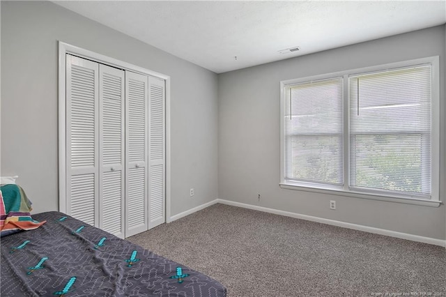 6501 Senator Dr, Fayetteville, NC 28304 - unfurnished bedroom featuring carpet flooring and a closet