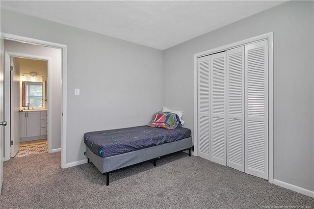 6501 Senator Dr, Fayetteville, NC 28304 - carpeted bedroom with baseboards and a closet