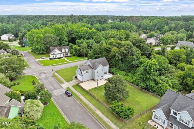 1505 Mclaurin Ln, Fuquay Varina, NC 27526 - aerial view of residential area featuring a heavily wooded area