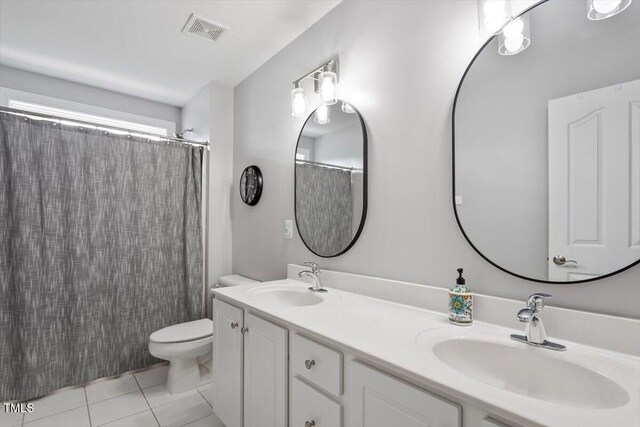 1505 Mclaurin Ln, Fuquay Varina, NC 27526 - bathroom with double vanity, tile patterned floors, and a shower with curtain