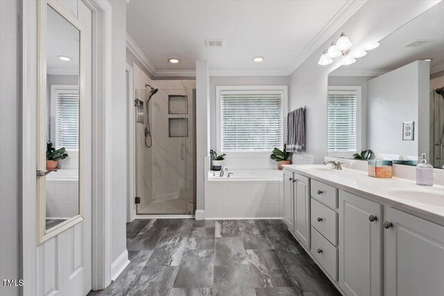 1505 Mclaurin Ln, Fuquay Varina, NC 27526 - full bathroom featuring ornamental molding, a bath, a stall shower, double vanity, and recessed lighting