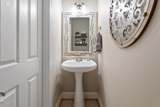 1505 Mclaurin Ln, Fuquay Varina, NC 27526 - bathroom featuring baseboards and tile patterned flooring