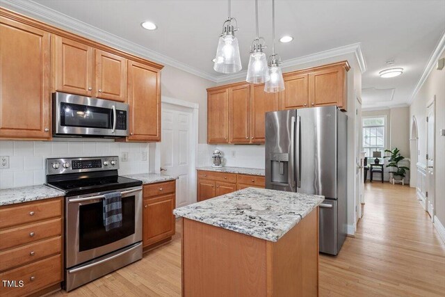 1505 Mclaurin Ln, Fuquay Varina, NC 27526 - kitchen featuring stainless steel appliances, light wood finished floors, tasteful backsplash, ornamental molding, and light stone countertops