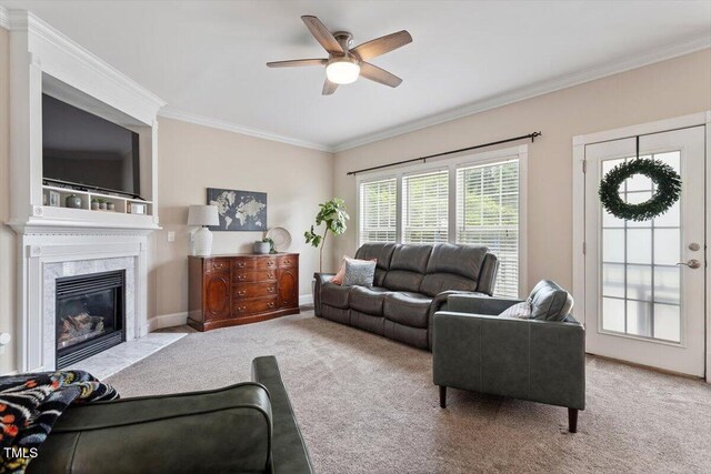 1505 Mclaurin Ln, Fuquay Varina, NC 27526 - carpeted living area featuring crown molding, ceiling fan, and a high end fireplace