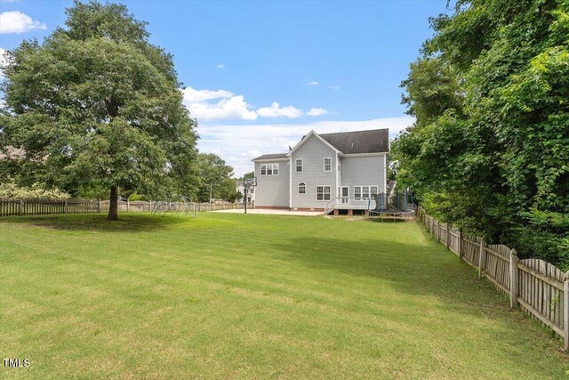 1505 Mclaurin Ln, Fuquay Varina, NC 27526 - fenced backyard featuring a deck