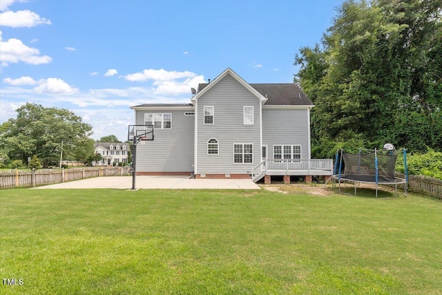 1505 Mclaurin Ln, Fuquay Varina, NC 27526 - rear view of property with a trampoline, a patio, a wooden deck, and a chimney