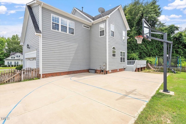1505 Mclaurin Ln, Fuquay Varina, NC 27526 - view of sport court featuring a trampoline and basketball hoop