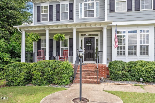 1505 Mclaurin Ln, Fuquay Varina, NC 27526 - view of exterior entry featuring a porch