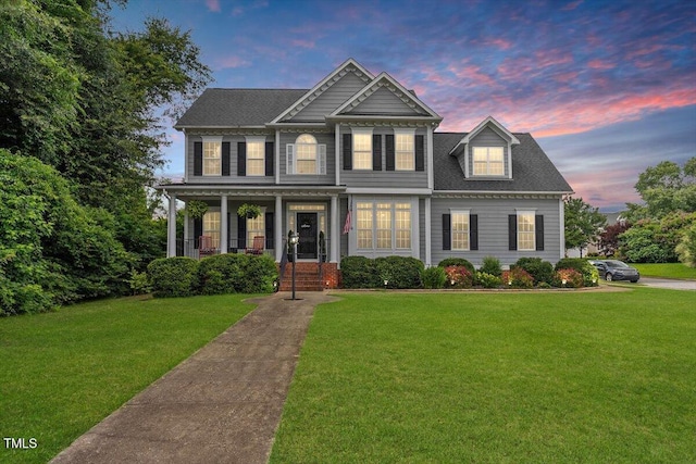 1505 Mclaurin Ln, Fuquay Varina, NC 27526 - colonial house featuring a lawn, covered porch, and roof with shingles