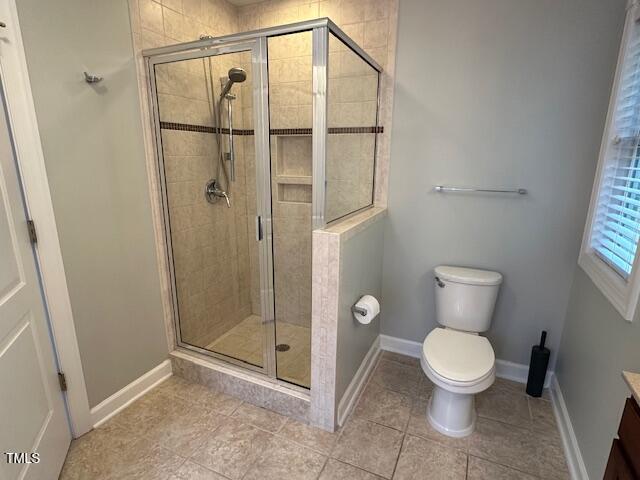 1113 Bexley Hills Bnd, Apex, NC 27502 - bathroom featuring vanity, a stall shower, and tile patterned floors