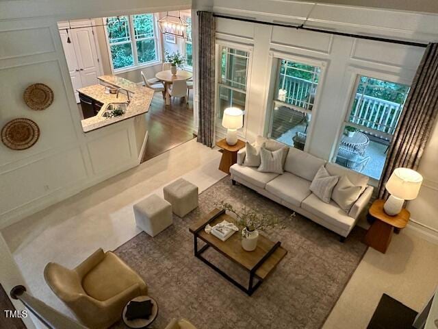 1113 Bexley Hills Bnd, Apex, NC 27502 - living area with healthy amount of natural light and a decorative wall