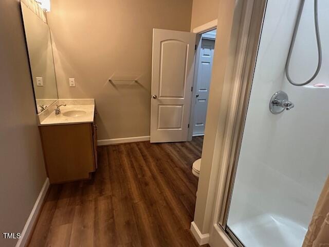 1113 Bexley Hills Bnd, Apex, NC 27502 - bathroom with a stall shower, vanity, and wood finished floors