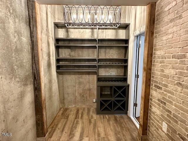 1113 Bexley Hills Bnd, Apex, NC 27502 - wine room with wood finished floors and a chandelier