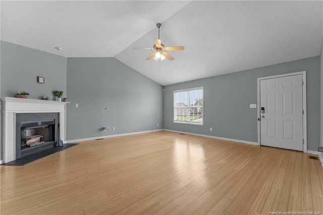 159 Falling Leaf Dr, Raeford, NC 28376 - unfurnished living room with a ceiling fan, lofted ceiling, light wood-style floors, and a fireplace