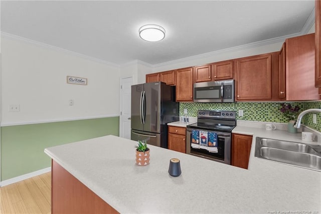 159 Falling Leaf Dr, Raeford, NC 28376 - kitchen featuring stainless steel appliances, light countertops, crown molding, tasteful backsplash, and a peninsula