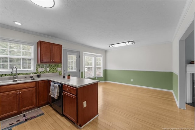 159 Falling Leaf Dr, Raeford, NC 28376 - kitchen featuring dishwasher, crown molding, a peninsula, a textured ceiling, and healthy amount of natural light