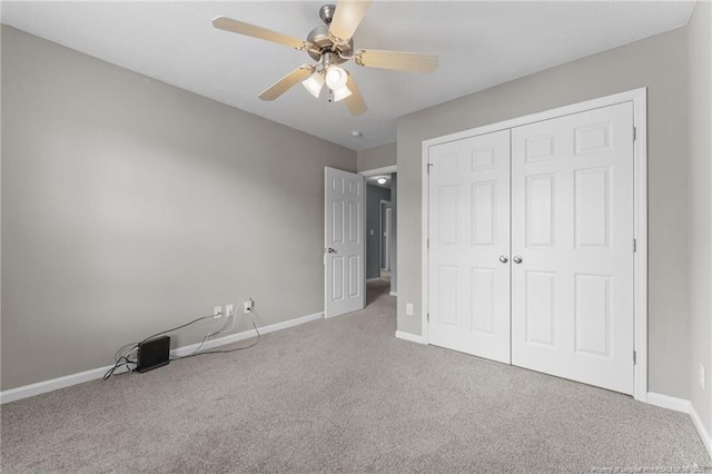 159 Falling Leaf Dr, Raeford, NC 28376 - unfurnished bedroom with carpet, a closet, and a ceiling fan