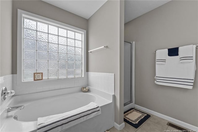 159 Falling Leaf Dr, Raeford, NC 28376 - full bathroom featuring a bath, tile patterned floors, and a shower stall